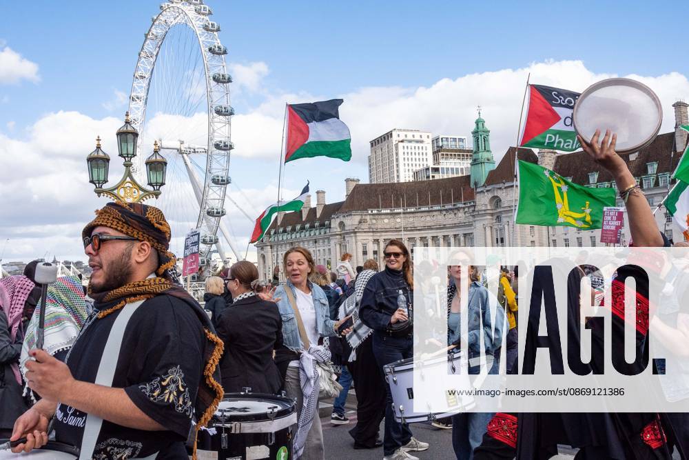 The National March for Palestine took place to mark the third anniversary of the start of the war in Gaza. Around ten thousand gathered on The Thames embankment and marched to Parliament Squre. They faced an Israeli counter demonstration of a handfull of protesters. Some arrests were reported by police. London England - ZUMAr169 20261010_zip_r169_037