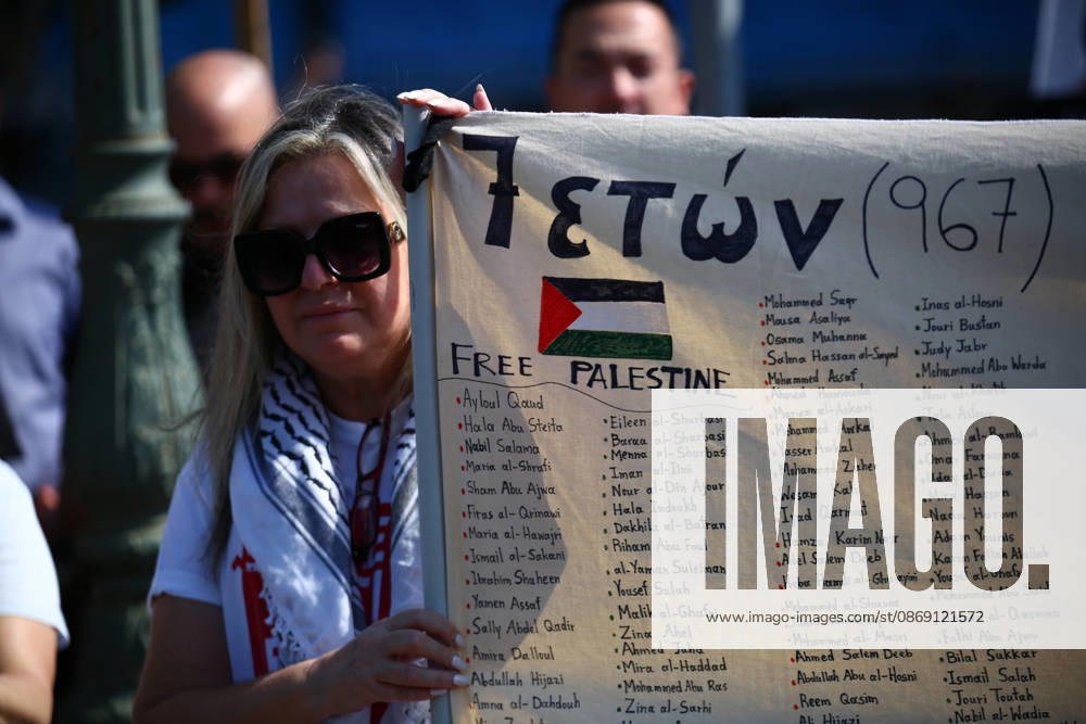 A woman holds a banner bearing the names of Palestinians children killed in Gaza during a pro-Palestinian demonstration. Athens GREECE - ZUMAx103 20261010_zip_x103_002