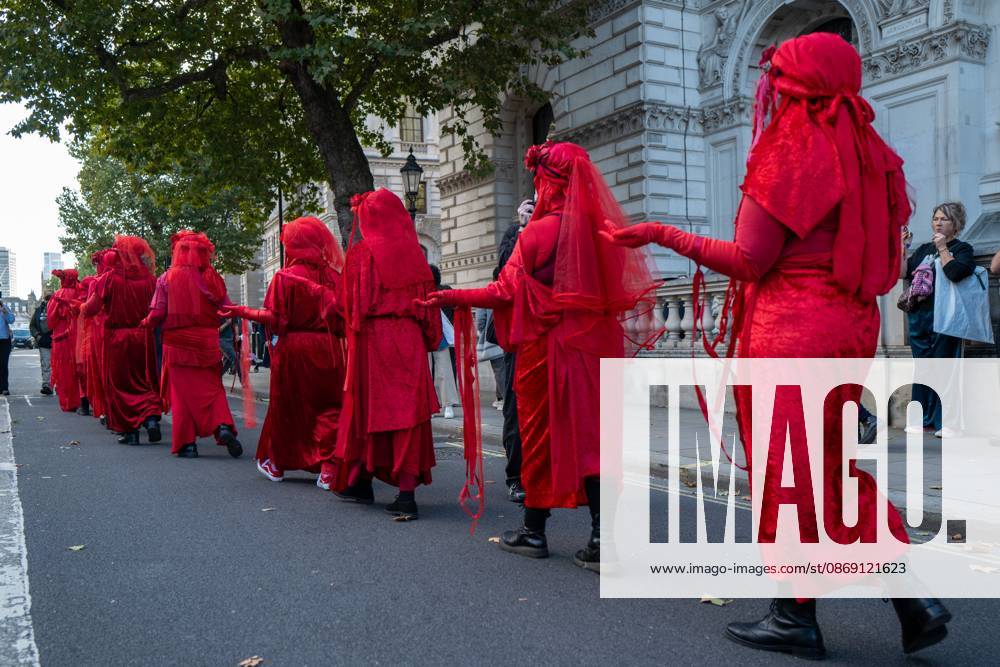 Performers from Extinction Rebellion s Red Rebel Brigade stage a silent Walk of Shame procession during the National March for Palestine in London. The National March marks three years since the outbreak of the war in Gaza in October 2023.The National March for Palestine, which was organised by the Palestine Coalition in London. The march marks three years since the outbreak of the war in Gaza in October 2023 London United Kingdom - ZUMAs197 20261010_aaa_s197_059
