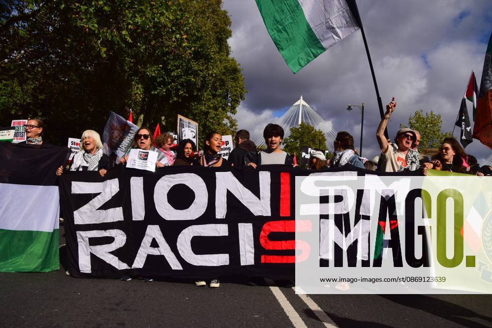 Protesters hold a Zionism is racism banner during the National March for Palestine..Thousands of people marched in Central London marking three years of what the protest organisers call the genocide against the Palestinian people in Gaza London United Kingdom - ZUMAs197 20261010_aaa_s197_172