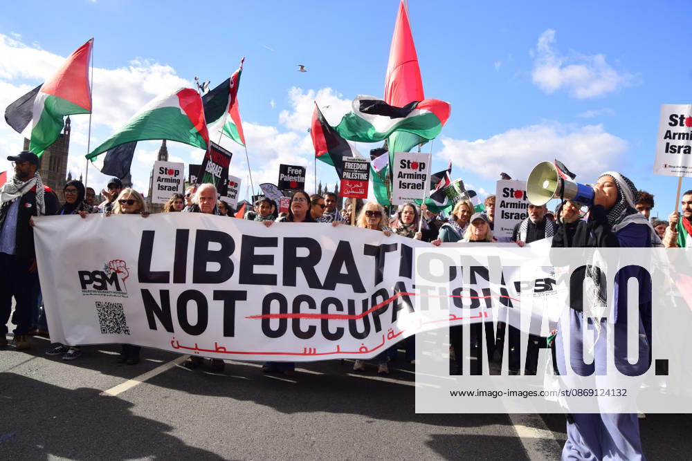 Protesters pass over Westminster Bridge past the Houses of Parliament during the National March for Palestine. Thousands of people marched in Central London marking three years of what the protest organisers call the genocide against the Palestinian people in Gaza London United Kingdom - ZUMAv130 20261010_zip_v130_072