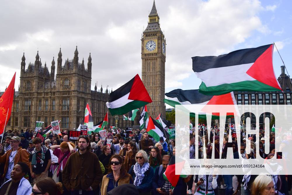 Protesters hold Palestinian flags on Westminster Bridge during the National March for Palestine..Thousands of people marched in Central London marking three years of what the protest organisers call the genocide against the Palestinian people in Gaza London United Kingdom - ZUMAs197 20261010_aaa_s197_182