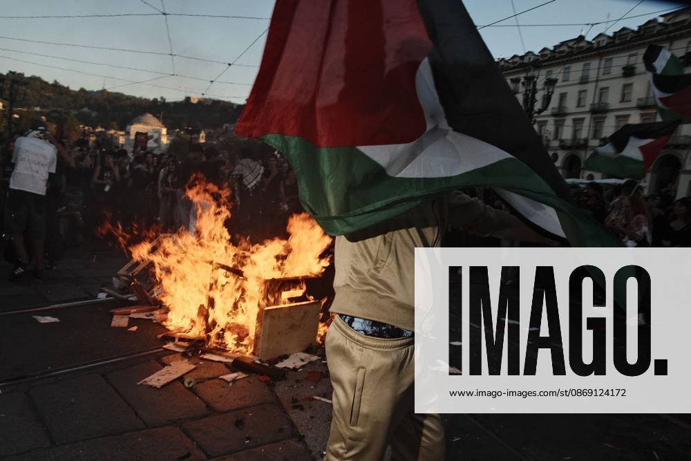 Turin, IT: TURIN, ITALY, OCTOBER 10, 2026: Thousands of pro-Palestinian demonstrators march through Turin during a protest organized by the Torino per Gaza coalition. Tensions erupted near Piazza Castello when police blocked access to the square, leading to clashes between demonstrators and riot police before some protesters were allowed to enter. Participants carried Palestinian flags and displayed effigies of Israeli Prime Minister Benjamin Netanyahu and US President Donald Trump as they marched through the city in support of Palestine. Turin IT - ZUMAq101 20261010_zna_q101_254