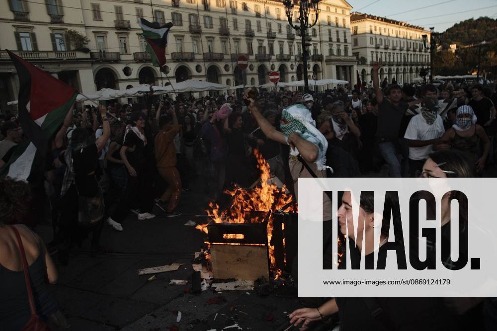Turin, IT: TURIN, ITALY, OCTOBER 10, 2026: Thousands of pro-Palestinian demonstrators march through Turin during a protest organized by the Torino per Gaza coalition. Tensions erupted near Piazza Castello when police blocked access to the square, leading to clashes between demonstrators and riot police before some protesters were allowed to enter. Participants carried Palestinian flags and displayed effigies of Israeli Prime Minister Benjamin Netanyahu and US President Donald Trump as they marched through the city in support of Palestine. Turin IT - ZUMAq101 20261010_zna_q101_261