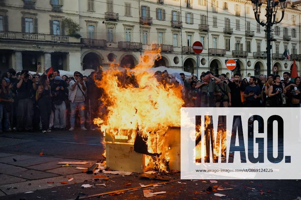 TURIN, ITALY, OCTOBER 10, 2026: Thousands of pro-Palestinian demonstrators march through central Turin during a regional protest organized by Torino per Gaza, as demonstrations take place across Italy in solidarity with Palestinians. Tensions erupted near Piazza Castello when protesters attempted to cross a police cordon, leading to brief confrontations before the march continued through the city. Demonstrators carried Palestinian flags and large effigies depicting US President Donald Trump and Israeli Prime Minister Benjamin Netanyahu. Toward the end of the demonstration, protesters threw tomatoes at the effigies before setting them on fire. Turin Italy - ZUMAq101 20261010_zna_q101_306