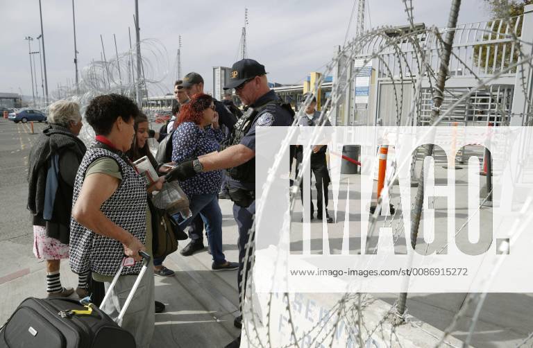 Migrant caravan Migrants from Central America have their backgrounds checked in Tijuana on the Mexican side of the border with the United States on Nov. 19, 2018.
