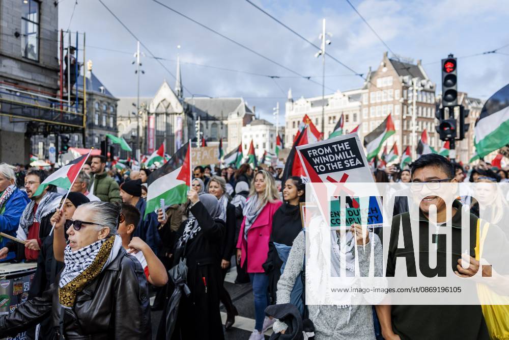AMSTERDAM - Demonstrators during a national protest on Dam Square marking the conclusion of the nationwide week of action for sanctions against Israel. According to various activist groups, despite the ceasefire , the genocide against the Palestinian people continues unabated. KOEN VAN WEEL ANP netherlands out - belgium out