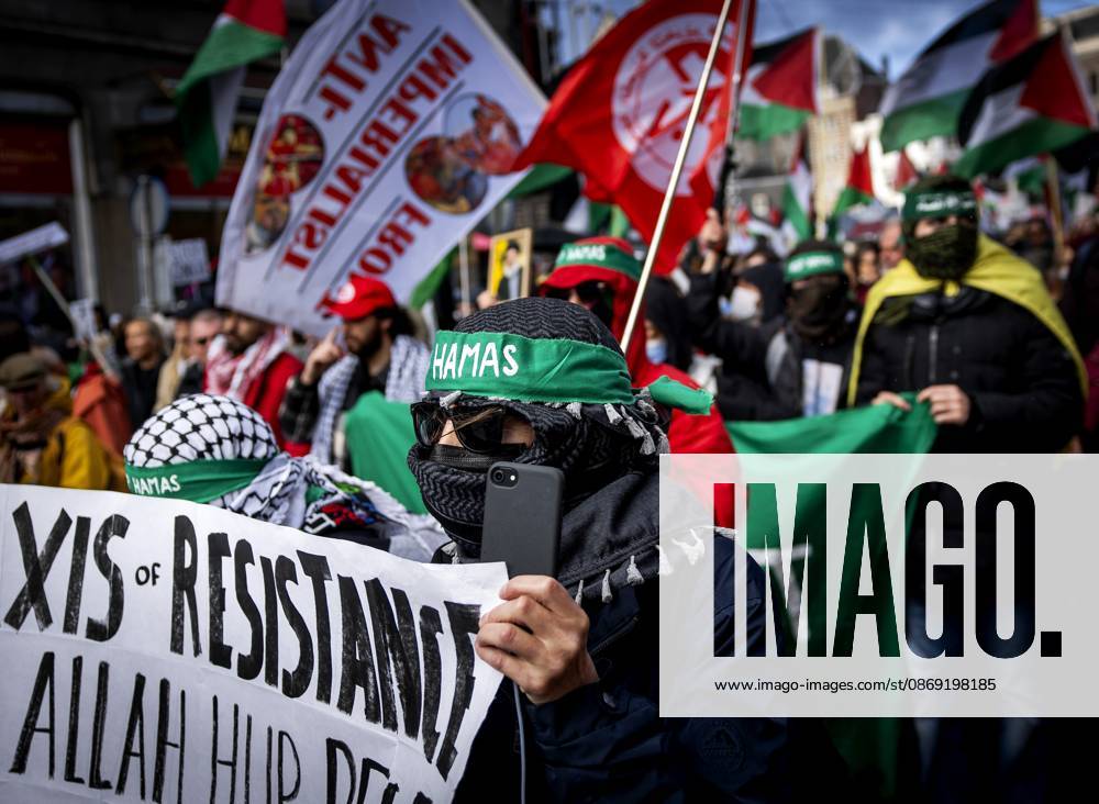AMSTERDAM - Demonstrators during a national protest on Dam Square marking the conclusion of the nationwide week of action for sanctions against Israel. According to various activist groups, despite the ceasefire , the genocide against the Palestinian people continues unabated. KOEN VAN WEEL ANP netherlands out - belgium out