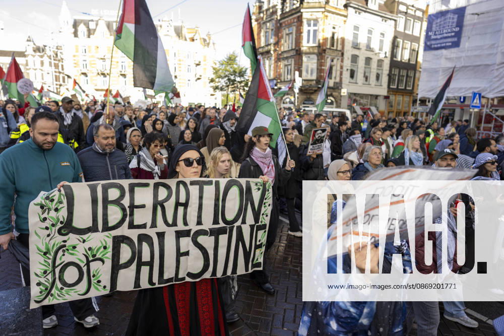 Amsterdam, Noord-Holland, The Netherlands: October 11, 2026, Amsterdam, Netherlands: Demonstrators carry a banner reading Liberation for Palestine during a pro-Palestinian march through central Amsterdam. Amsterdam The Netherlands - ZUMAl165 20261011_zip_l165_016