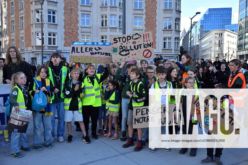 Tens of thousands march in Brussels demanding stronger climate action BRUSSELS, BELGIUM - OCTOBER 11: Demonstrators hold climate-themed placards as tens of thousands of people march through Brussels calling for stronger action against climate change and reduced dependence on fossil fuels, on October 11, 2026 in Brussels, Belgium. The protest was organized by the Belgian Climate Coalition, which brings together around 100 civil society organizations. Participants marched along major roads toward Schuman Square, home to several European Union institutions, while protesting the government s climate policies. Dursun Aydemir Anadolu Brussels Belgium. Editorial use only. Please get in touch for any other usage.
