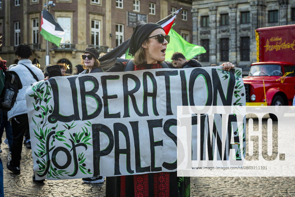 Amsterdam, North Holland, The Netherlands - Holland: 11 October 2026, Amsterdam, the Netherlands: Protesters gathered at Dam Square for speeches and anti-war music before marching through AmsterdamÃ¢â‚¬â ¢s city centre in a demonstration dubbed Ã¢â‚¬oeThree Years of GenocideÃ¢â‚¬Â. The event marked three years since the start of the IsraelÃ¢â‚¬Hamas war. Demonstrators carried Palestinian flags and banners, demanding the Dutch government act against what they describe as a genocide in Gaza. Amsterdam The Netherlands - Holland - ZUMAp202 20261011_zip_p202_006