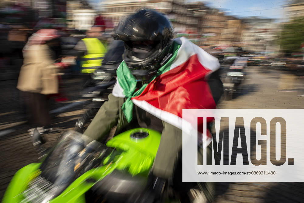 Amsterdam, North Holland, The Netherlands - Holland: 11 October 2026, Amsterdam, the Netherlands: The group Bikers for Palestine departs from Dam Square. Protesters gathered at Dam Square for speeches and anti-war music before marching through AmsterdamÃ¢â‚¬â ¢s city centre in a demonstration dubbed Ã¢â‚¬oeThree Years of GenocideÃ¢â‚¬Â. The event marked three years since the start of the IsraelÃ¢â‚¬Hamas war. Demonstrators carried Palestinian flags and banners, demanding the Dutch government act against what they describe as a genocide in Gaza. Amsterdam The Netherlands - Holland - ZUMAp202 20261011_zip_p202_022