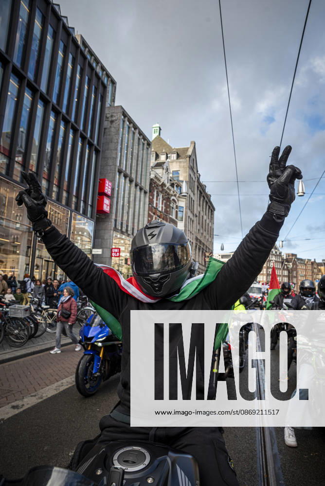 Amsterdam, North Holland, The Netherlands - Holland: 11 October 2026, Amsterdam, the Netherlands: The group Bikers for Palestine departs from Dam Square. Protesters gathered at Dam Square for speeches and anti-war music before marching through Amsterdamâ€⠢s city centre in a demonstration dubbed â€oeThree Years of Genocideâ€Â. The event marked three years since the start of the Israelâ€Hamas war. Demonstrators carried Palestinian flags and banners, demanding the Dutch government act against what they describe as a genocide in Gaza. Amsterdam The Netherlands - Holland - ZUMAp202 20261011_zip_p202_025