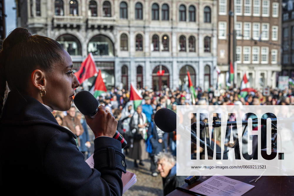 Amsterdam, North Holland, The Netherlands - Holland: 11 October 2026, Amsterdam, the Netherlands: A speaker addresses hundreds of pro-Palestinian protesters gathered at Dam Square. Following more speeches and anti-war music, they marched through Amsterdamâ€⠢s city centre in a demonstration dubbed â€oeThree Years of Genocideâ€Â. The event marked three years since the start of the Israelâ€Hamas war. Demonstrators carried Palestinian flags and banners, demanding the Dutch government act against what they describe as a genocide in Gaza. Amsterdam The Netherlands - Holland - ZUMAp202 20261011_zip_p202_027