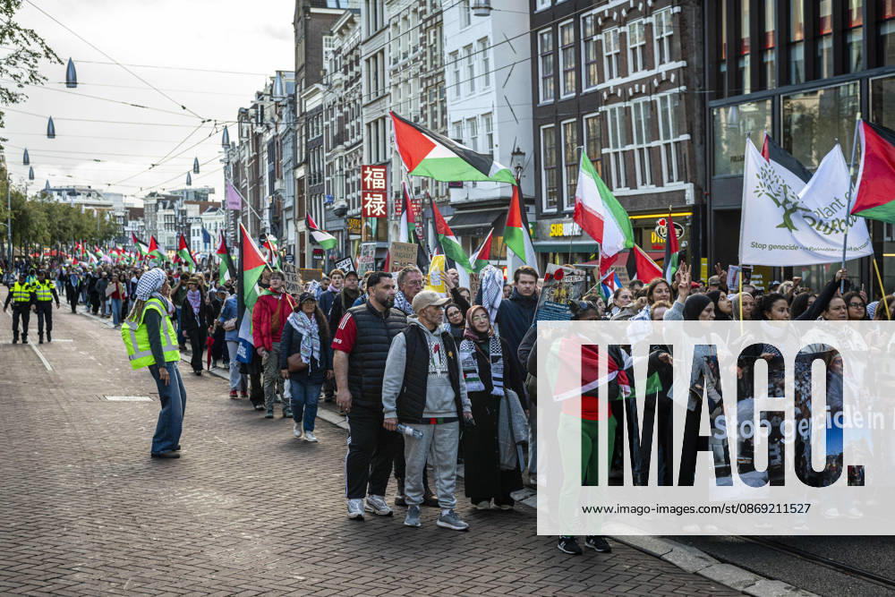 Amsterdam, North Holland, The Netherlands - Holland: 11 October 2026, Amsterdam, the Netherlands: Protesters gathered at Dam Square for speeches and anti-war music before marching through Amsterdamâ€⠢s city centre in a demonstration dubbed â€oeThree Years of Genocideâ€Â. The event marked three years since the start of the Israelâ€Hamas war. Demonstrators carried Palestinian flags and banners, demanding the Dutch government act against what they describe as a genocide in Gaza. Amsterdam The Netherlands - Holland - ZUMAp202 20261011_zip_p202_028