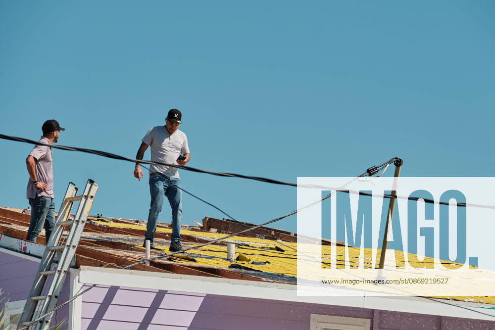 Pensacola Beach, Florida, U.S: October 11, 2026 Pensacola Beach, Florida USA: Contractors get on the roof to inspect itâ€⠢s damage after the arrival of Hurricane Isaias. Pensacola Beach U.S - ZUMAa14_ 20261011_zaf_a14_020