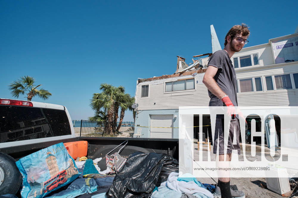 ALEX DEAN loads up the back of his truck with belonging from his storm damaged apartment complex after the arrival of Hurricane Isaias. Pensacola Beach USA - ZUMAa14_ 20261011_zaf_a14_012