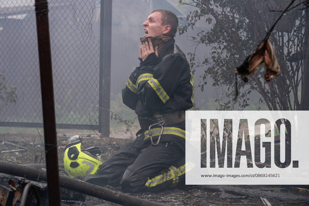 Russian drone attack on Kyiv leaves 3 injured KYIV, UKRAINE - OCTOBER 12: A firefighter kneels amid smoke and debris at the site of a Russian drone attack in the Darnytskyi district of Kyiv, Ukraine, on October 12, 2026. At least three people were injured in the attack, with damage reported in the Darnytskyi, Pecherskyi and Solomianskyi districts of the capital. Danylo Antoniuk Anadolu Kyiv Ukraine. Editorial use only. Please get in touch for any other usage.
