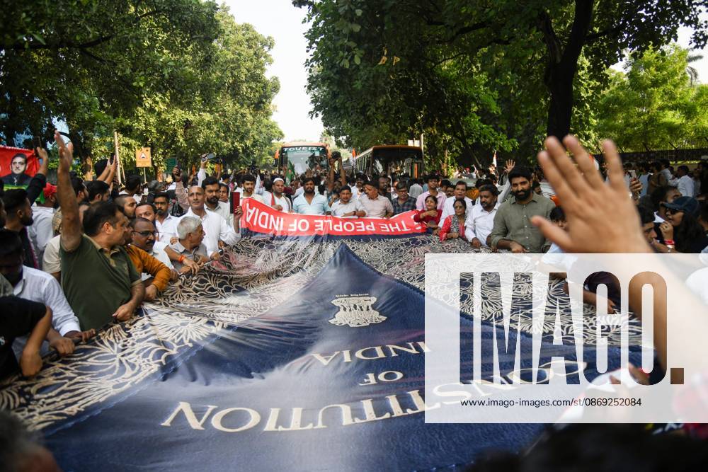 INDIA bloc leaders call for a march towards the Supreme Court New Delhi, Oct 12 (ANI): Supporters carry a large banner with the preamble of the Constitution of India during the INDIA bloc s protest march towards the Supreme Court, in New Delhi on Monday. New Delhi Delhi India