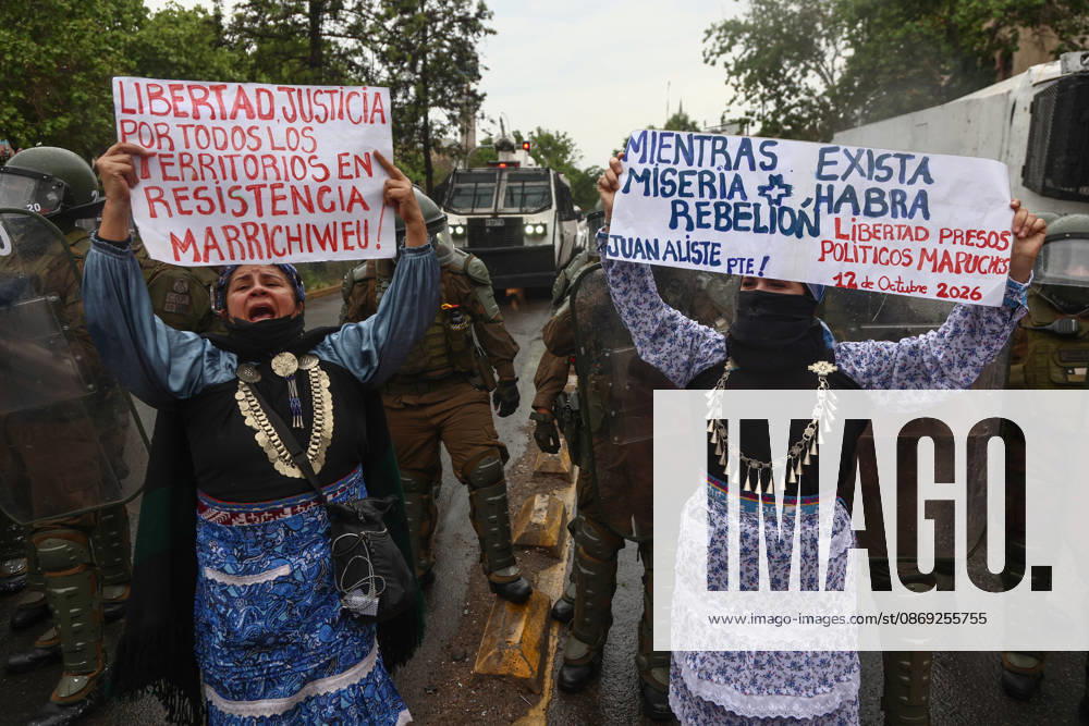 Hundreds of people protest against Columbus Day in Santiago SANTIAGO, CHILE - OCTOBER 12: Mapuche protesters hold up signs during the traditional protest against Columbus Day in Santiago, Chile, on October 12, 2026. The protesters demanded indigenous rights and territorial recognition. Lucas Aguayo Araos Anadolu Santiago Chile. Editorial use only. Please get in touch for any other usage.