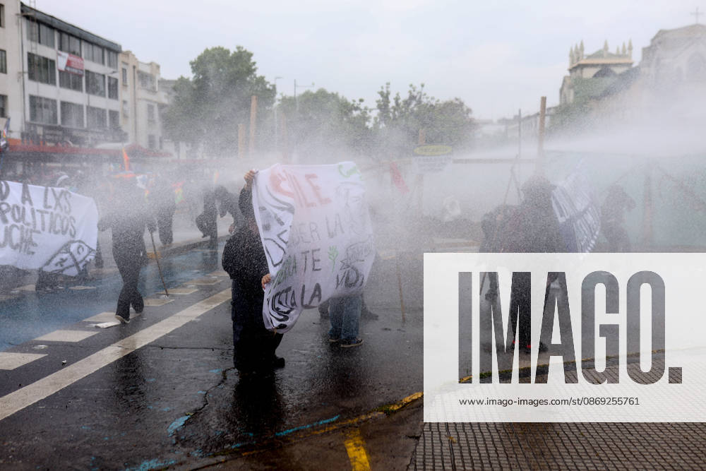 Hundreds of people protest against Columbus Day in Santiago SANTIAGO, CHILE - OCTOBER 12: Demonstrators clash with police during the traditional protest against Columbus Day in Santiago, Chile, on October 12, 2026. The protesters demanded Indigenous rights and territorial recognition. Lucas Aguayo Araos Anadolu Santiago Chile. Editorial use only. Please get in touch for any other usage.