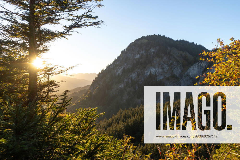 Autumn evening in the Allgäu: A view of the setting sun in the Bavarian Alps near Oberjoch, Bad Hindelang, Bavaria, Germany