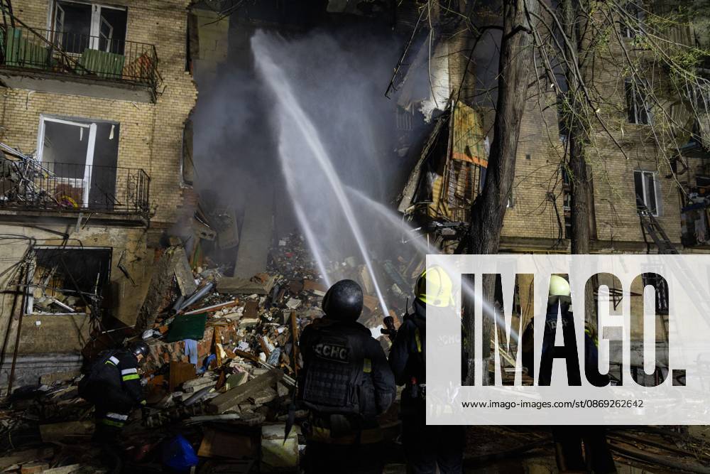 KHARKIV, UKRAINE, OCTOBER 12, 2026: Emergency workers conduct rescue operations at a residential building damaged in a Russian strike in Kharkiv s Kholodnohirskyi district. A firefighter was injured by falling concrete debris while clearing the rubble and was evacuated on a stretcher. Kharkiv Ukraine - ZUMAq101 20261013_zna_q101_002