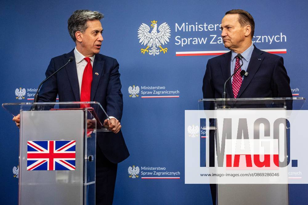 The Foreign Secretary of the United Kingdom, Ed Miliband, speaks directly to Poland s Minister of Foreign Affairs, Radoslaw Sikorski, during the press conference..Foreign Secretary of the United Kingdom of Great Britain and Northern Ireland visits the Ministry of Foreign Affairs in Warsaw, Poland for a meeting with the Republic of Poland s Foreign Minister, Radoslaw Sikorski. During the subsequent press conference, the ministers discussed their countries ongoing cooperation in foreign policy issues, including supporting Ukraine in the war Russia is waging against it. Miliband also spoke of the ties his family has to Poland. Afterwards, the ministers travel to the second day of the Warsaw Security - ZUMAs197 20261013_aaa_s197_022