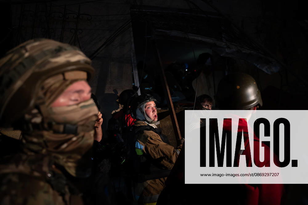 Local firefighters tackle a blaze following a Russian missile attack on a residential area in Kharkiv, Ukraine, on October 13, 2026. The strike killed multiple people and injured several others, as emergency services worked to extinguish fires and search for victims amid the rubble. Kharkiv Ukraine - ZUMAm350 20261012_zip_m350_023