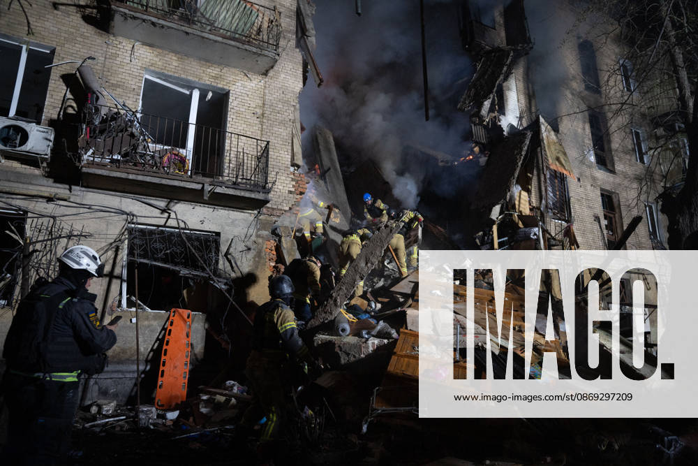 Local firefighters tackle a blaze following a Russian missile attack on a residential area in Kharkiv, Ukraine, on October 13, 2026. The strike killed multiple people and injured several others, as emergency services worked to extinguish fires and search for victims amid the rubble. Kharkiv Ukraine - ZUMAm350 20261012_zip_m350_024