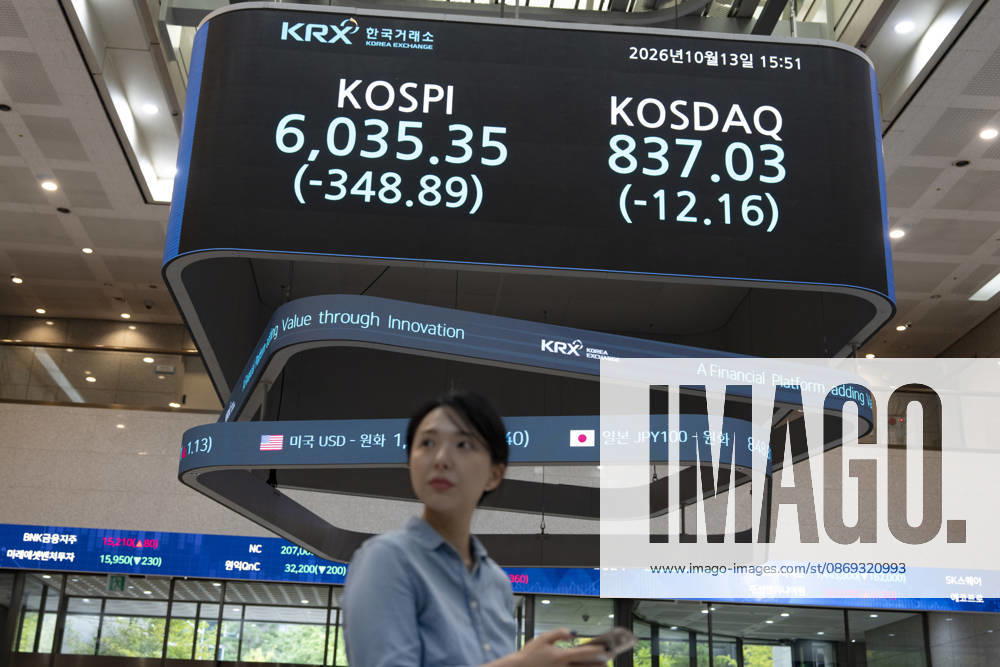 South Korea Stocks Plunge As KOSPI Drops Sharply At KRX In Seoul A Korea Exchange (KRX) employee checks her smartphone near the main electronic board displaying the closing KOSPI index at 6,035.35 (-348.89) and KOSDAQ index at 837.03 (-12.16) in Yeouido, Seoul, South Korea, on October 13, 2026. Seoul Seoul South Korea