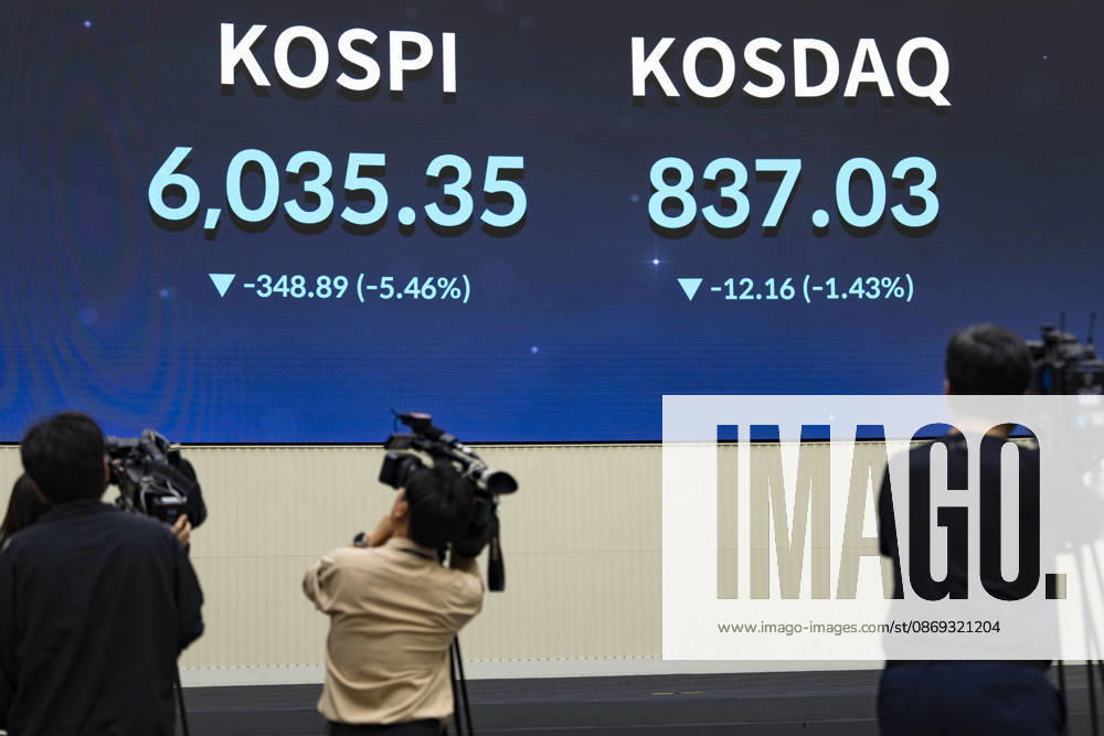 South Korea Stocks Plunge As KOSPI Drops Sharply At KRX In Seoul Media personnel and monitors in the Korea Exchange (KRX) trading hall display market data in Yeouido, Seoul, South Korea, on October 13, 2026. The KOSPI index dropped to 6,035.35, down 348.89 points (-5.46%), alongside the KRW USD exchange rate shown on side screens. Seoul Seoul South Korea