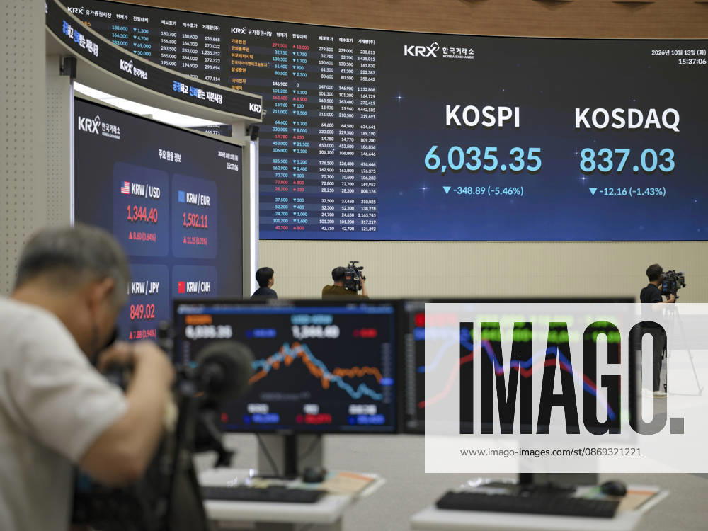 South Korea Stocks Plunge As KOSPI Drops Sharply At KRX In Seoul Media personnel and monitors in the Korea Exchange (KRX) trading hall display market data in Yeouido, Seoul, South Korea, on October 13, 2026. The KOSPI index dropped to 6,035.35, down 348.89 points (-5.46%), alongside the KRW USD exchange rate shown on side screens. Seoul Seoul South Korea