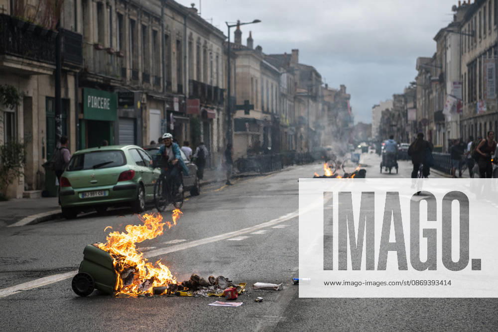 High School Stdent Mobilisation - Bordeaux Rubbish bins and waste burn in the roadway as cyclists and pedestrians pass nearby during Act V of the high school student mobilisation in Bordeaux, France on October 13, 2026. Photo by Fabrice Sapte ABACAPRESS.COM Bordeaux France