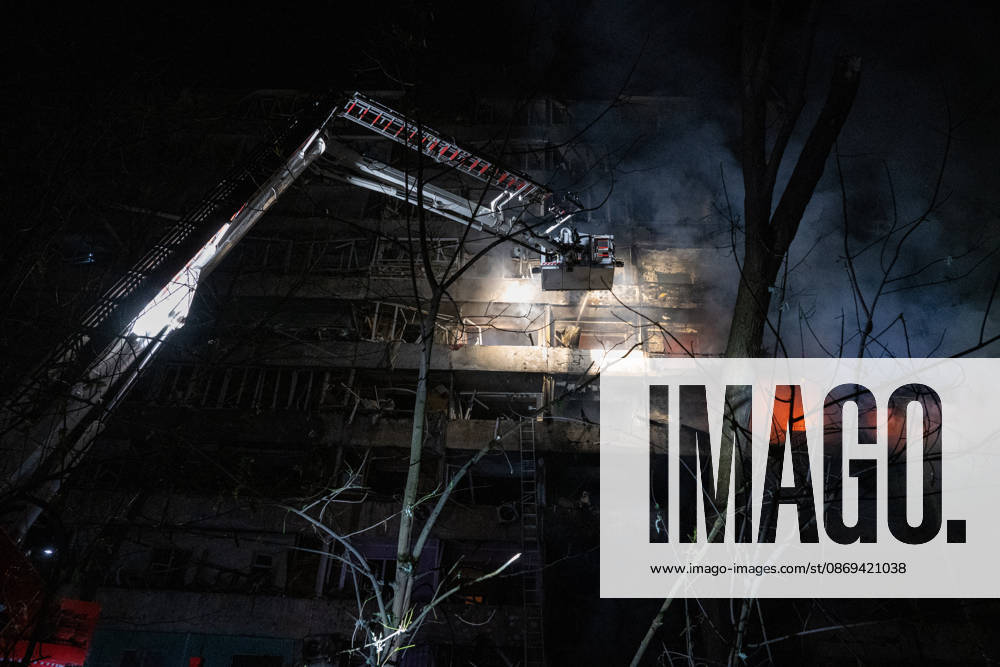 3 Dead and 19 Injured as Russian Missile Hits Residential Building - Kyiv A rescuer on an aerial platform extinguishes a fire that broke out following a Russian missile strike on a nine-story residential building in Kyiv? Desnianskyi district, Ukraine, on October 14, 2026. Russia launched a massive ballistic missile attack on the capital. Three women were killed and 19 other people were injured in the Desnianskyi district, including a seven-year-old girl. Apartments in the nine-story building were also damaged from the first through the eighth floor Photo by Danylo Antoniuk Ukrinform ABACAPRESS.COM Kyiv Ukraine