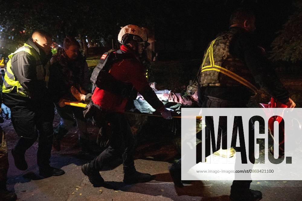 3 Dead and 19 Injured as Russian Missile Hits Residential Building - Kyiv Rescuers carry an injured person on a stretcher after a Russian missile strike on a nine-story residential building in the Desnianskyi district of Kyiv, Ukraine, on October 14, 2026. Russia launched a massive ballistic missile attack on the capital. Three women were killed and 19 people were injured in the Desnianskyi district, including a seven-year-old girl. Apartments on the first through eighth floors of the building were also damaged Photo by Danylo Antoniuk Ukrinform ABACAPRESS.COM Kyiv Ukraine