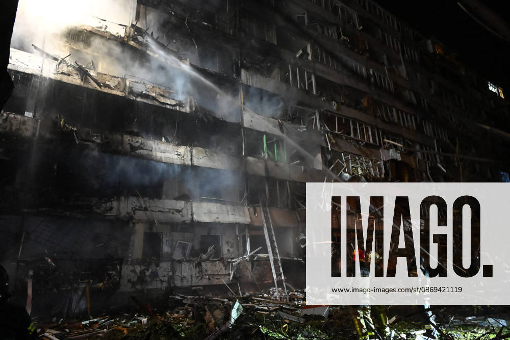 3 Dead and 19 Injured as Russian Missile Hits Residential Building - Kyiv Rescuers extinguish a fire that broke out following a Russian missile strike on a nine-story residential building in Kyiv? Desnianskyi district, Ukraine, on October 14, 2026. Russia launched a massive ballistic missile attack on the capital. Three women were killed and 19 people were injured in the Desnianskyi district, including a seven-year-old girl. Apartments on the first through eighth floors of the building were also damaged Photo by Oleksandr Klymenko Ukrinform ABACAPRESS.COM Kyiv Ukraine