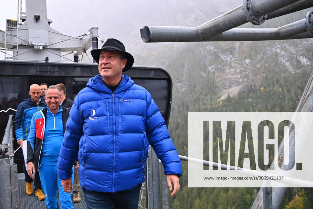 Markus SOEDER, Minister-President of Bavaria and CSU Chairman, steps out of the Zugspitzbahn gondola and climbs a cable car support tower at a dizzying height. Minister-President Dr. Markus Soeder and Environment Minister Thorsten Glauber meet with geol