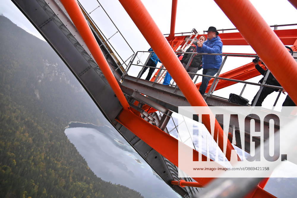 Markus SOEDER, Minister-President of Bavaria and CSU Chairman, steps out of the Zugspitzbahn gondola halfway up the mountain, stands on one of the cable car’s support towers at a dizzying height, and looks o