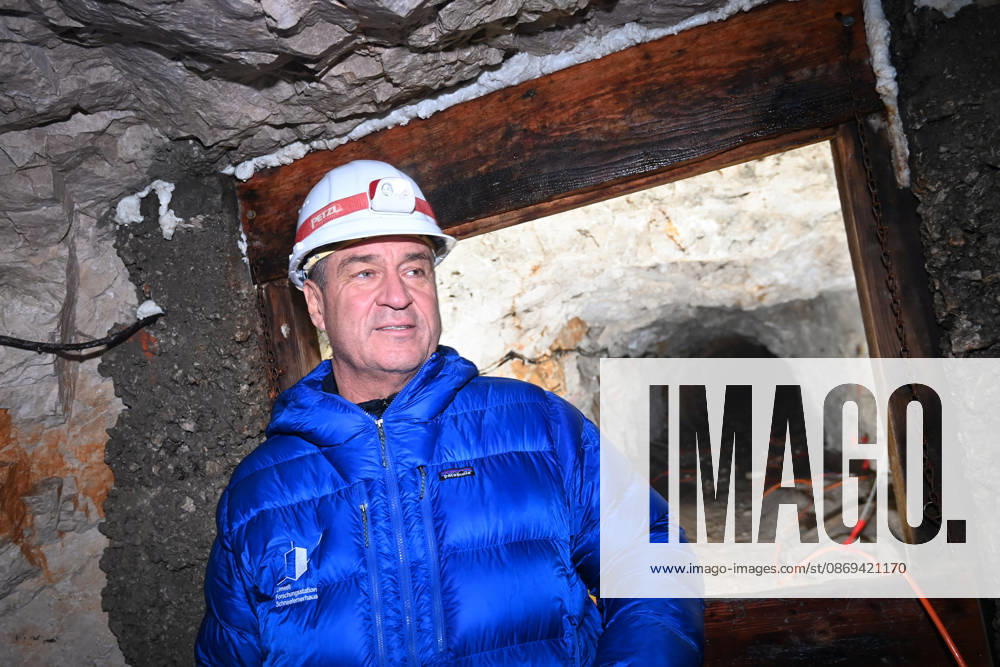 Markus SOEDER, Minister-President of Bavaria and CSU Chairman, stands in front of the entrance to a tunnel, examining the permafrost inside,which is melting year after year as a result of climate change. Minister-Preside
