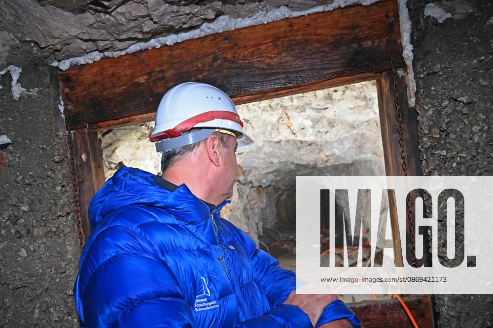 Markus SOEDER, Minister-President of Bavaria and CSU Chairman, stands in front of the entrance to a tunnel, examining the permafrost inside,which is melting year after year as a result of climate change. Minister-Preside