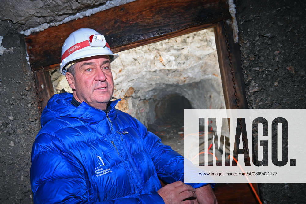 Markus SOEDER, Minister-President of Bavaria and CSU Chairman, stands in front of the entrance to a tunnel, examining the permafrost inside,which is melting year after year as a result of climate change. Minister-Preside
