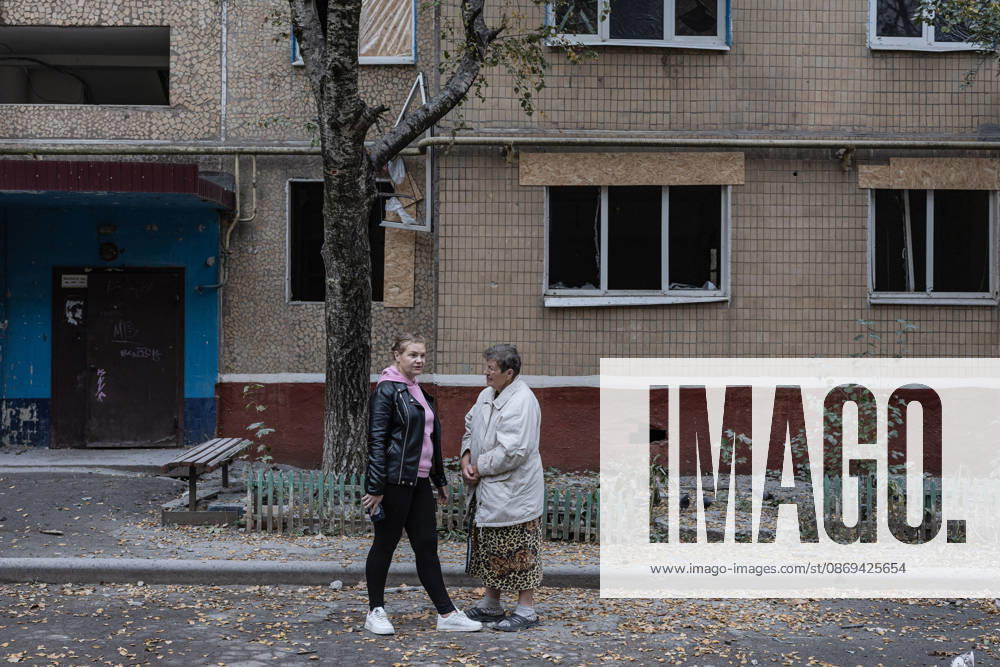 Russian air strike hits residential building in Kramatorsk KRAMATORSK, UKRAINE - OCTOBER 14: Two woman are seen in front of a residential building burnt and damaged following a Russian air strike in Kramatorsk, Ukraine, on October 14, 2026. Diego Herrera Carcedo Anadolu Kramatorsk Ukraine. Editorial use only. Please get in touch for any other usage.
