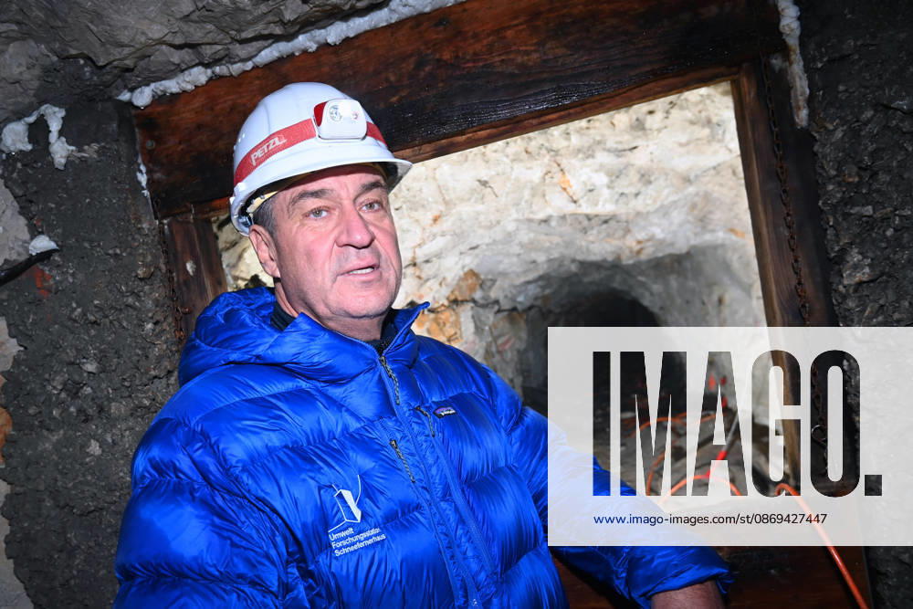 Markus SOEDER, Minister-President of Bavaria and CSU Chairman, stands in front of the entrance to a tunnel, examining the permafrost inside,which is melting year after year as a result of climate change. Minister-Preside