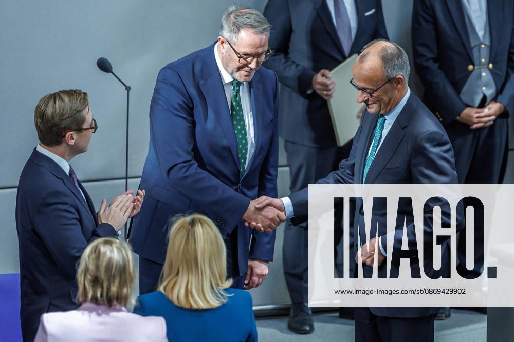 Bundestag: Federal Chancellor Friedrich Merz (CDU) and Alexander Schweitzer (SPD), Federal Minister of Labor and Social Affairs, after being sworn in at the German Bundestag on October 14, 2026, in Berlin, Berlin, Berlin, Germany, Bundestag