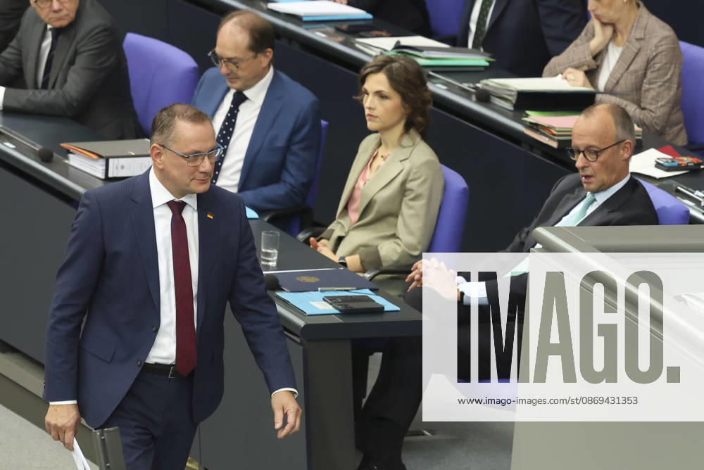 Tino Chrupalla and Friedrich Merz at the session of the German Bundestag on October 14, 2026, in Berlin; Chancellor Merz delivering the government’s policy statement to the German Bundestag
