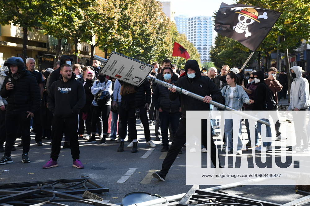 Clashes erupt outside Ministry of Education in Tirana during student protest over academic conditions TIRANA, ALBANIA - OCTOBER 14: University students stage protest outside the Ministry of Education building in Tirana, Albania, on October 14, 2026. A protest organized by university students demanding improvements to educational infrastructure and funding escalated into violent clashes as civic supporters joined the crowds. Demonstrators hurled Molotov cocktails, stones, and improvised projectiles at the ministry and law enforcement officers, setting fire to trash containers. In response, law enforcement officers used water cannons and tear gas to disperse the protesters. Olsi Shehu Anadolu Tirana Albania. Editorial use only. Please get i