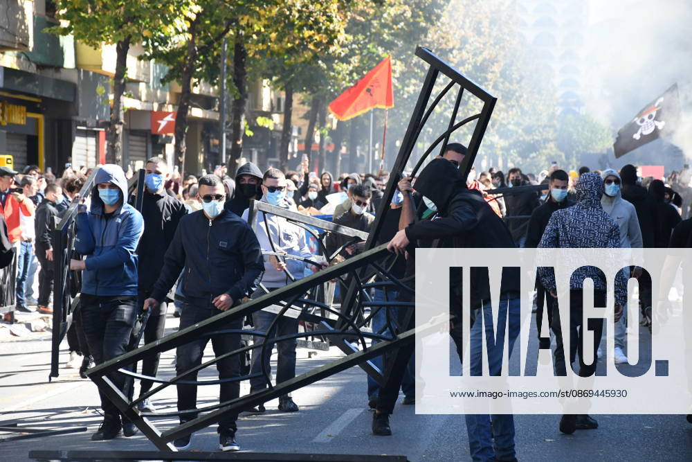 Clashes erupt outside Ministry of Education in Tirana during student protest over academic conditions TIRANA, ALBANIA - OCTOBER 14: University students stage protest outside the Ministry of Education building in Tirana, Albania, on October 14, 2026. A protest organized by university students demanding improvements to educational infrastructure and funding escalated into violent clashes as civic supporters joined the crowds. Demonstrators hurled Molotov cocktails, stones, and improvised projectiles at the ministry and law enforcement officers, setting fire to trash containers. In response, law enforcement officers used water cannons and tear gas to disperse the protesters. Olsi Shehu Anadolu Tirana Albania. Editorial use only. Please get i