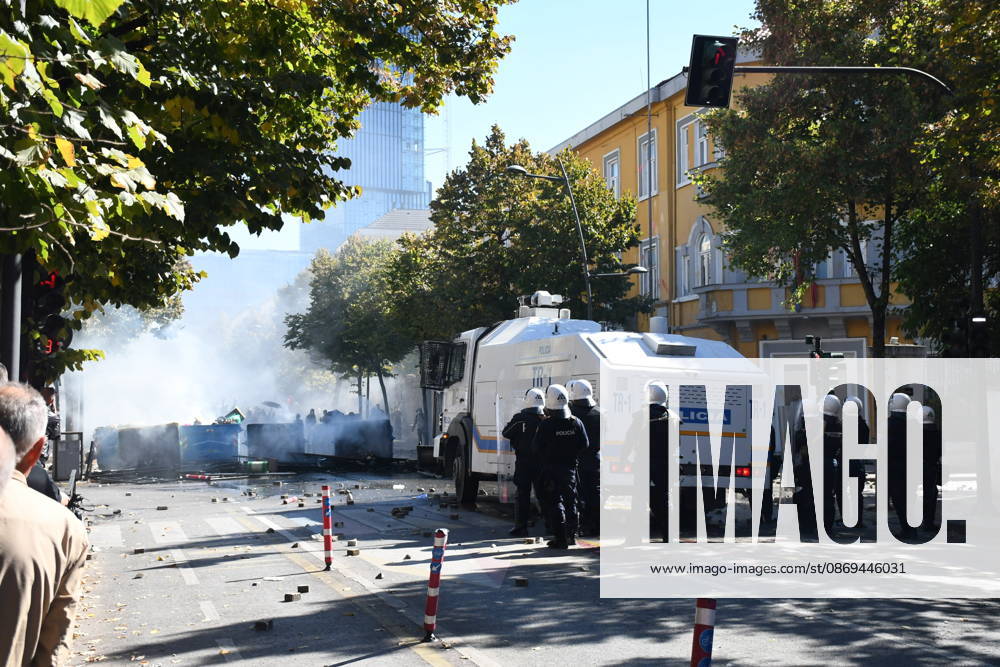 Clashes erupt outside Ministry of Education in Tirana during student protest over academic conditions TIRANA, ALBANIA - OCTOBER 14: University students stage protest outside the Ministry of Education building in Tirana, Albania, on October 14, 2026. A protest organized by university students demanding improvements to educational infrastructure and funding escalated into violent clashes as civic supporters joined the crowds. Demonstrators hurled Molotov cocktails, stones, and improvised projectiles at the ministry and law enforcement officers, setting fire to trash containers. In response, law enforcement officers used water cannons and tear gas to disperse the protesters. Olsi Shehu Anadolu Tirana Albania. Editorial use only. Please get i