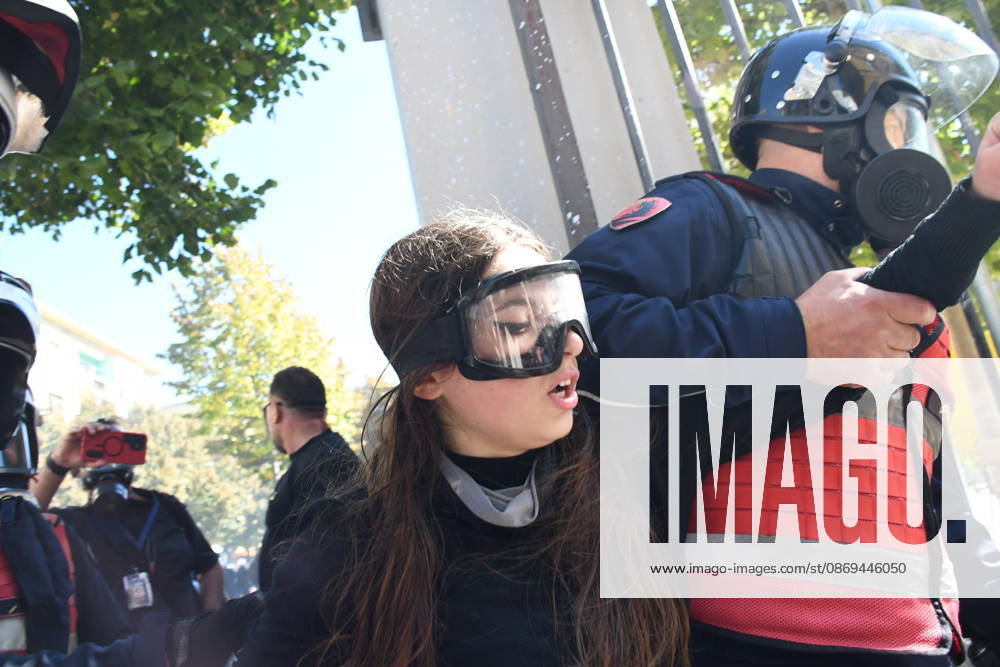 Clashes erupt outside Ministry of Education in Tirana during student protest over academic conditions TIRANA, ALBANIA - OCTOBER 14: University students stage protest outside the Ministry of Education building in Tirana, Albania, on October 14, 2026. A protest organized by university students demanding improvements to educational infrastructure and funding escalated into violent clashes as civic supporters joined the crowds. Demonstrators hurled Molotov cocktails, stones, and improvised projectiles at the ministry and law enforcement officers, setting fire to trash containers. In response, law enforcement officers used water cannons and tear gas to disperse the protesters. Olsi Shehu Anadolu Tirana Albania. Editorial use only. Please get i